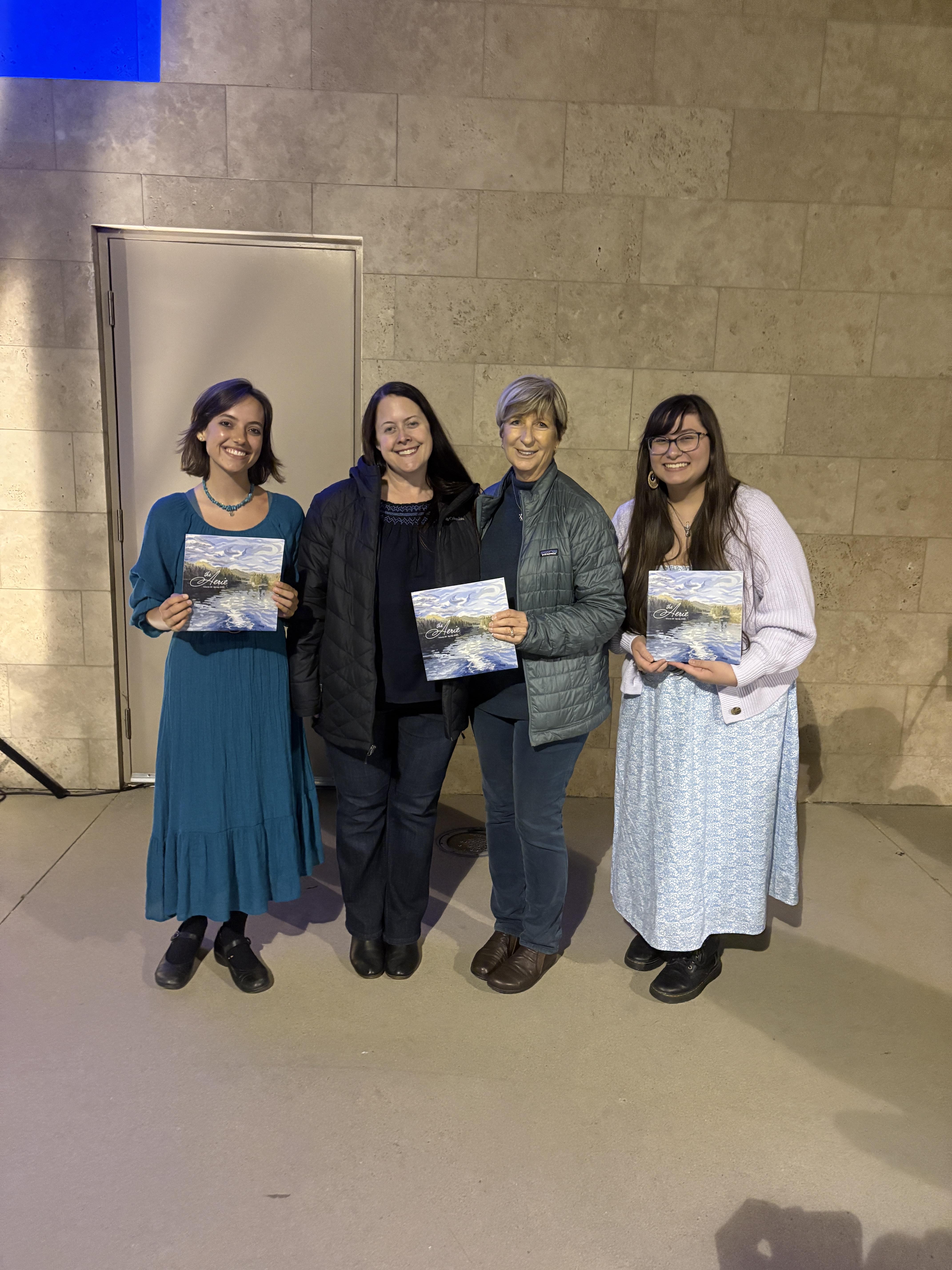 Madison Zuniga, Rachel Soo, Keelie Huebner-Chan, and Kristen Schmidt, hold copies of the Spring '25 Aerie